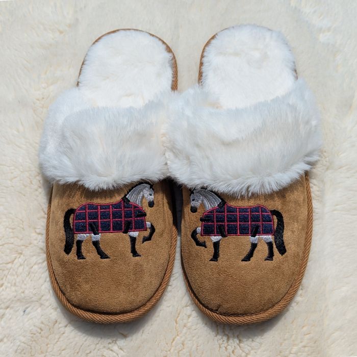 Super cozy faux fur slippers. Your feet can be just as cozy as your best friend! Exclusive art by horse artist Gary Guderian. High quality memory foam base, 100% Polyester. Available in two sizes: S/M (US Women's Size 7/8) and L/XL (US Women's Size 9/10). Each pair of slippers comes on a plastic hanger, with sewn in care label and size molded into base of slipper.